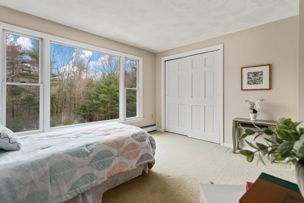 4 Darrell Drive North Reading, MA 01864 - Photo 21 of 41 a bedroom with a bed mirror and table