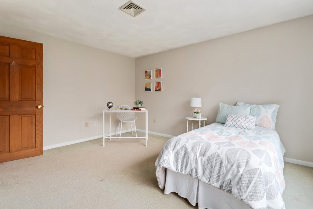 4 Darrell Drive North Reading, MA 01864 - Photo 22 of 41 a bedroom with a bed and chair