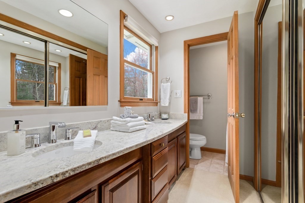4 Darrell Drive North Reading, MA 01864 - Photo 26 of 41 a bathroom with a granite countertop sink and a mirror