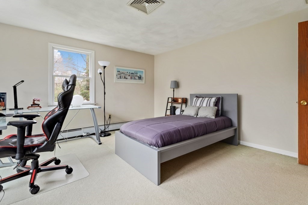 4 Darrell Drive North Reading, MA 01864 - Photo 30 of 41 a bedroom with a bed and a desk