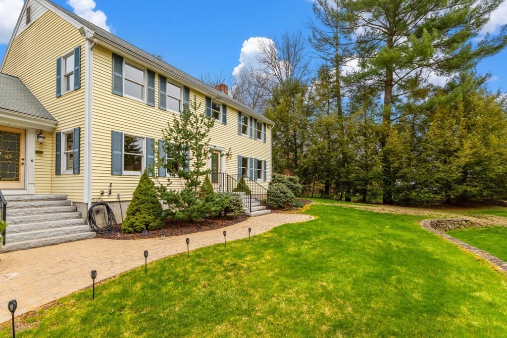 4 Darrell Drive North Reading, MA 01864 - Photo 3 of 41 a front view of a house with a yard