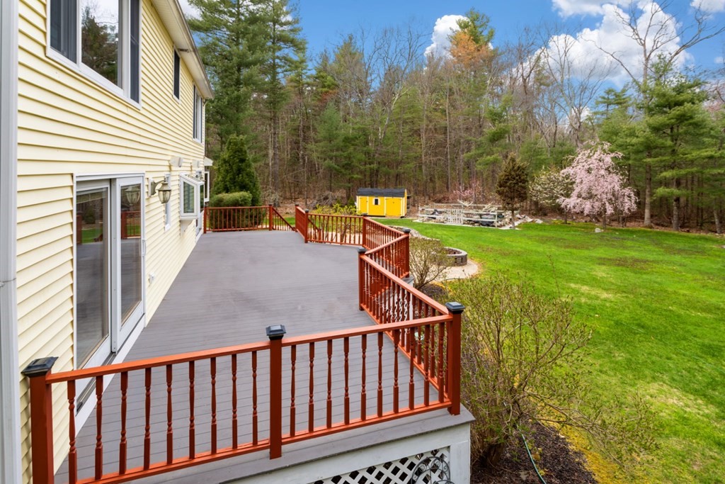 4 Darrell Drive North Reading, MA 01864 - Photo 41 of 41 a view of a balcony with two chairs and a fire pit