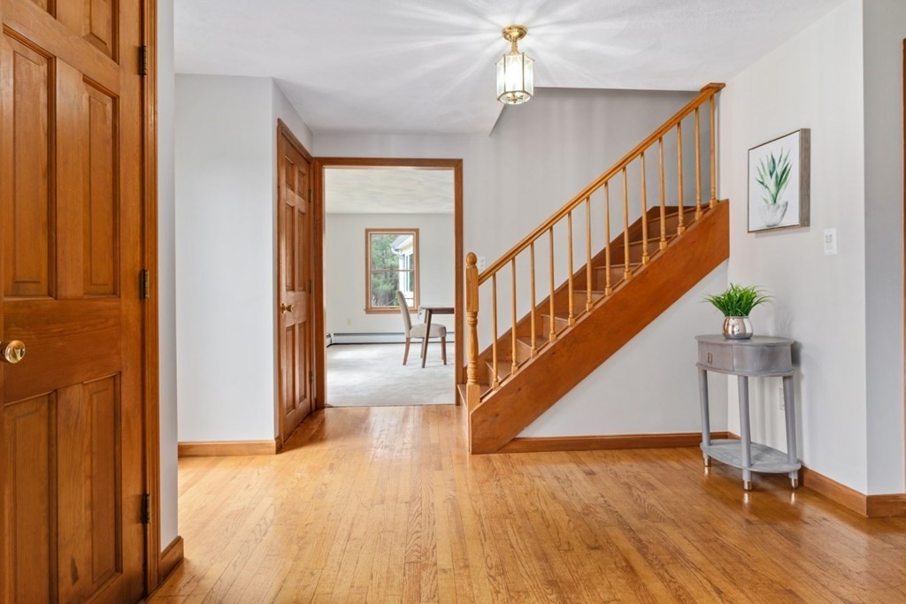 4 Darrell Drive North Reading, MA 01864 - Photo 5 of 41 a view of entryway and hall with wooden floor