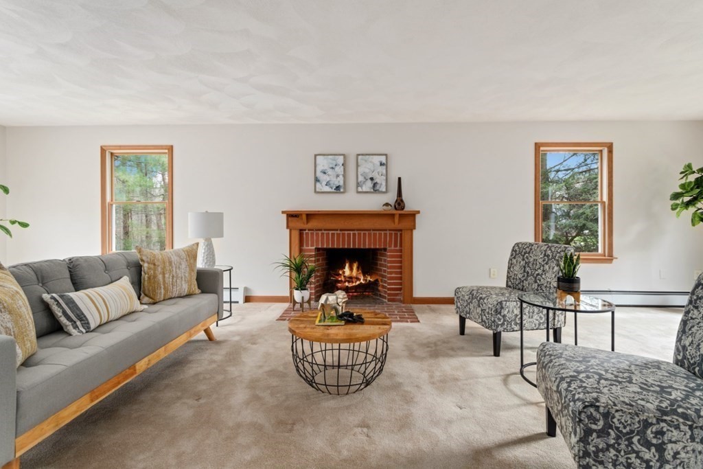 4 Darrell Drive North Reading, MA 01864 - Photo 8 of 41 a living room with furniture a rug and a fireplace