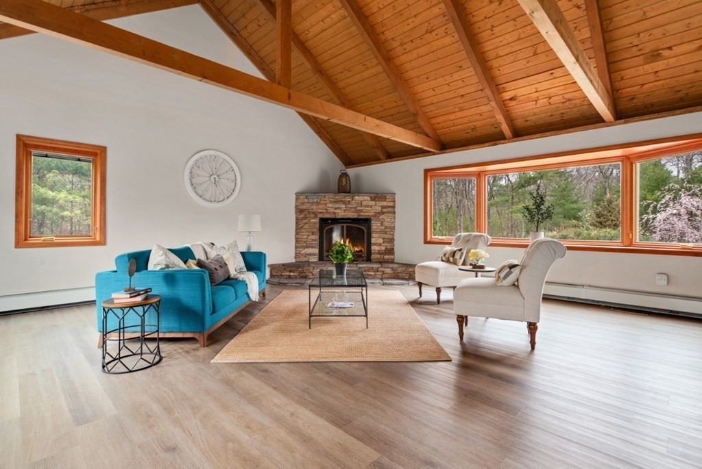 4 Darrell Drive North Reading, MA 01864 - Photo 9 of 41 a living room with furniture a fireplace and a large window