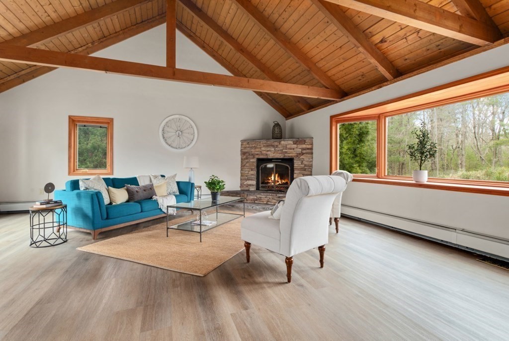 4 Darrell Drive North Reading, MA 01864 - Photo 10 of 41 a living room with furniture a fireplace and a large window