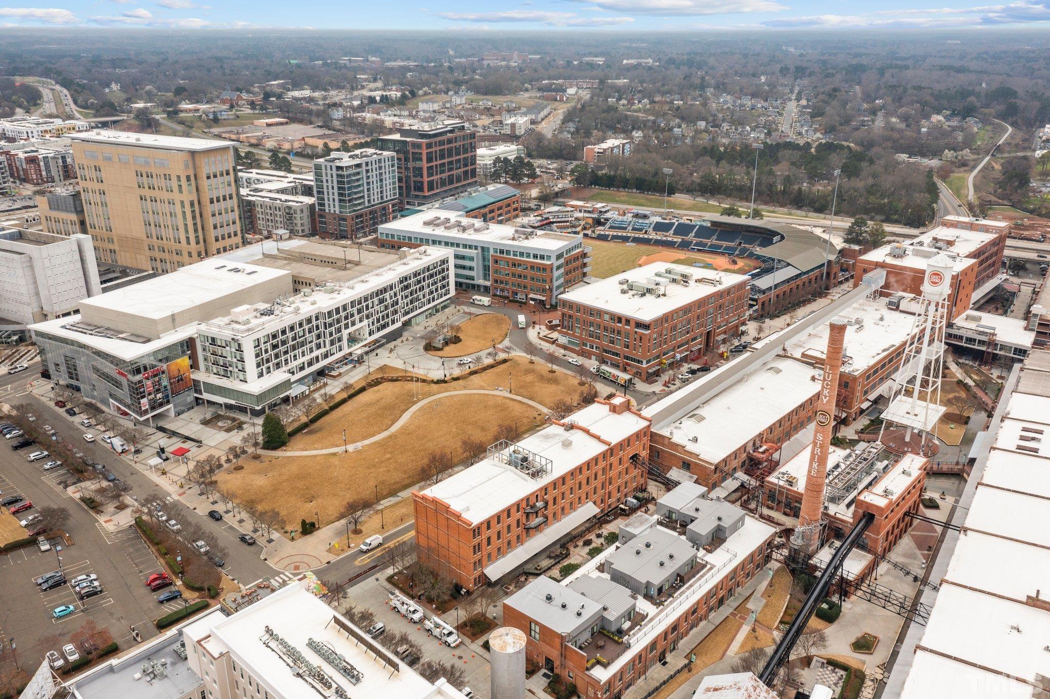 323 West Main Street, Unit J Durham, NC 27701 - Photo 29 of 36 an aerial view of a residential apartment building with a city view