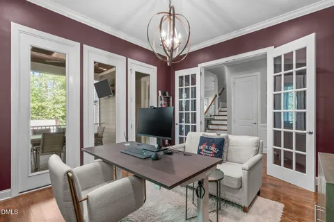 a living room with fireplace furniture and a flat screen tv