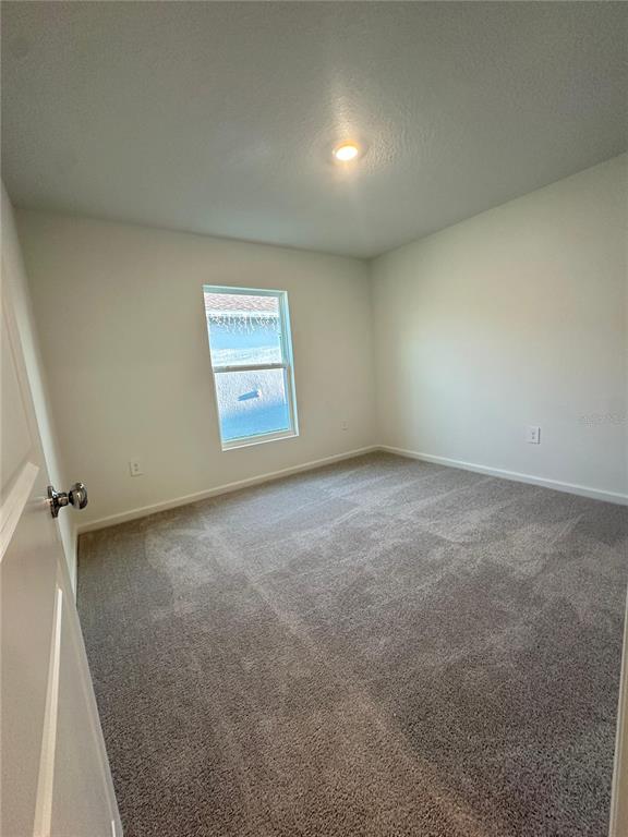 2117 Lasso Loop Eagle Lake, FL 33839 - Photo 31 of 41 an empty room with windows