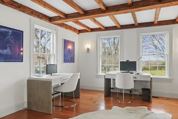 a dining room with furniture and a fireplace