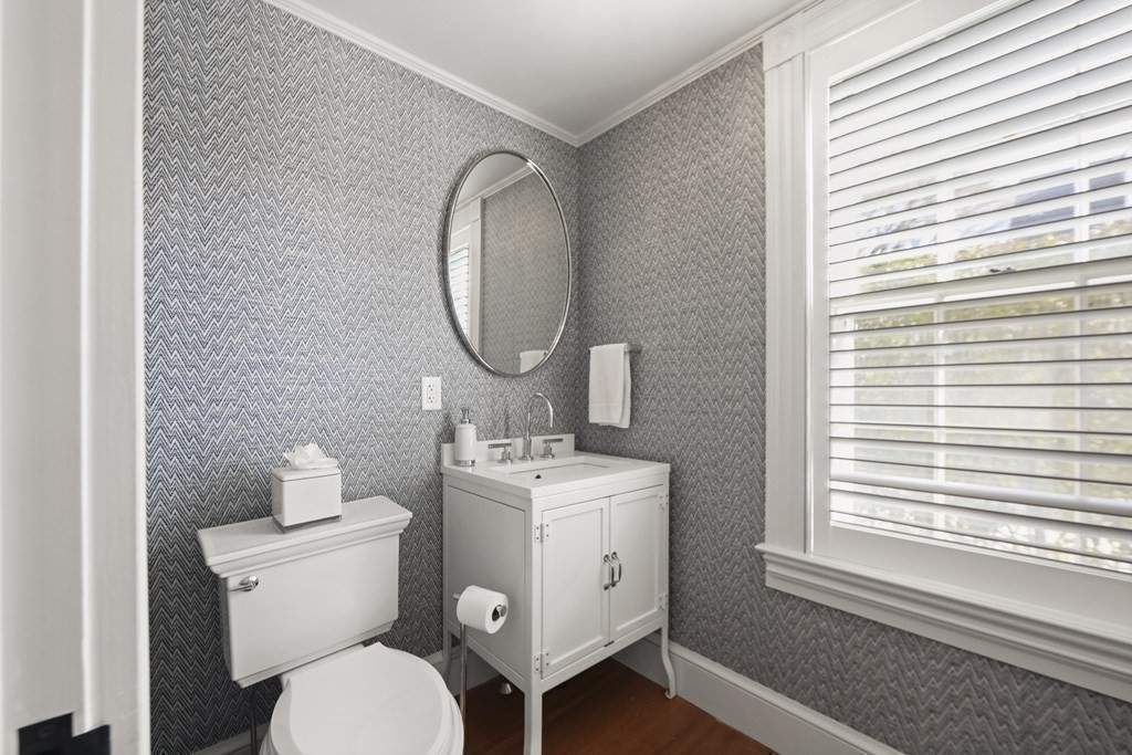 134 Main Street Nantucket, MA 02554 - Photo 14 of 42 a bathroom with a toilet sink and mirror