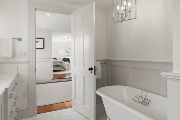 a bathroom with a sink a mirror and a shower