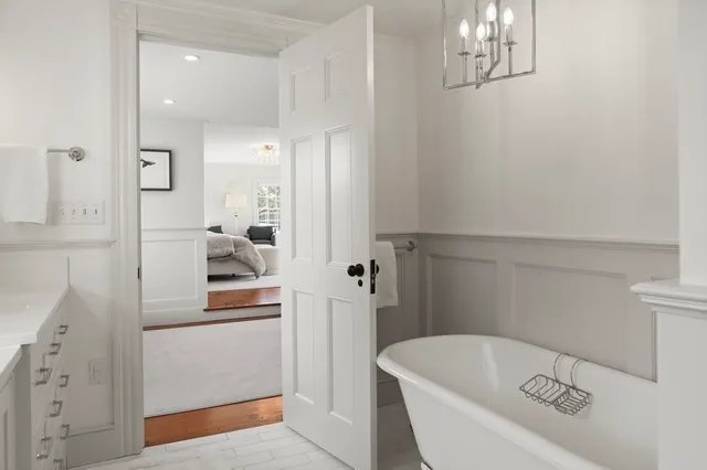 a bathroom with a sink a mirror and a shower