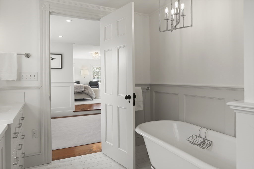 134 Main Street Nantucket, MA 02554 - Photo 17 of 42 a bathroom with a tub sink and mirror