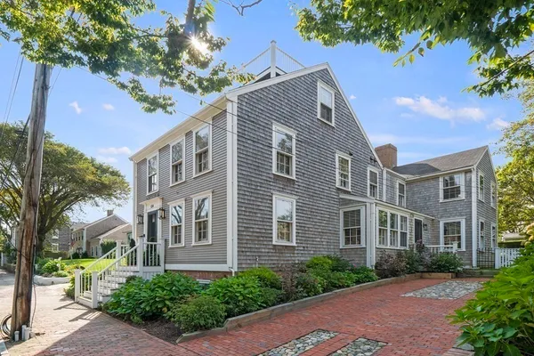 a front view of a building with garden