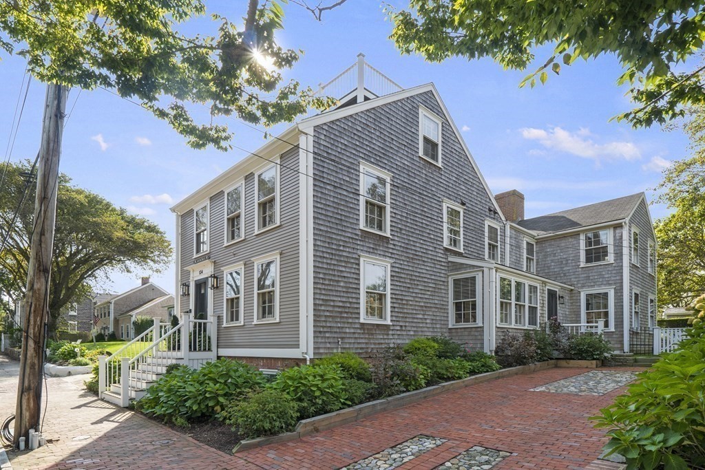 134 Main Street Nantucket, MA 02554 - Photo 2 of 42 a front view of a building with garden