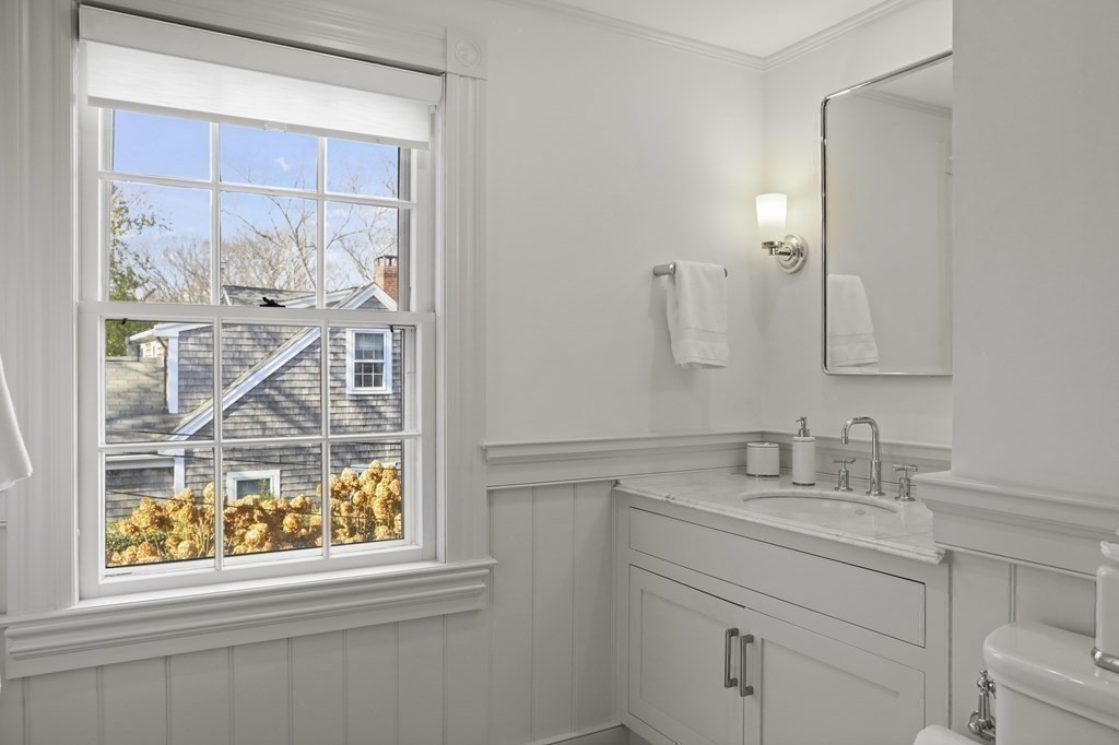 134 Main Street Nantucket, MA 02554 - Photo 24 of 42 a bathroom with a sink a mirror and a shower