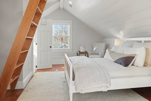 a bathroom with a toilet a sink and a mirror