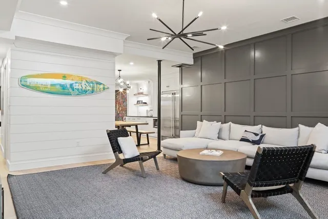 a living room with furniture and a table