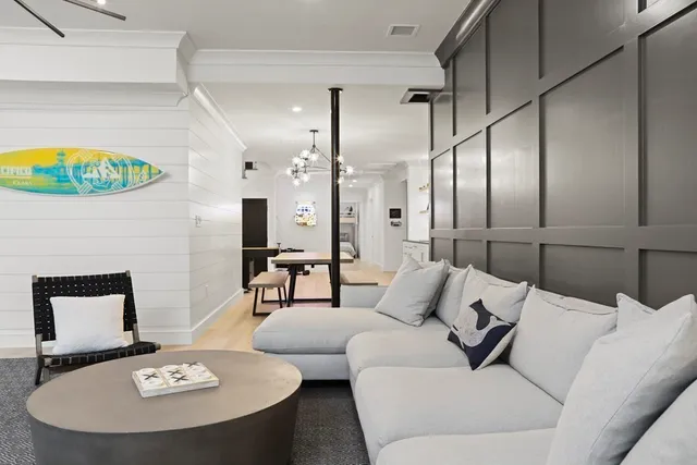 a kitchen with kitchen island granite countertop a sink cabinets and stainless steel appliances