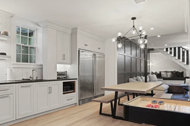 a room with pool table and glass door