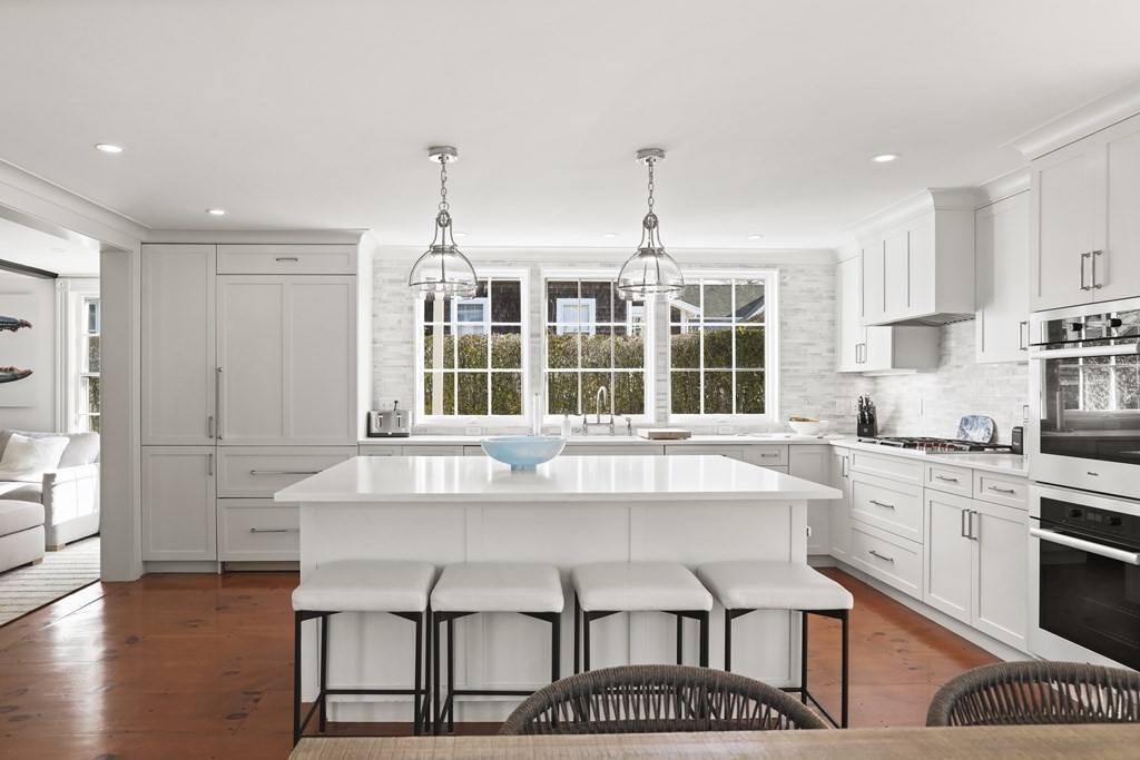 134 Main Street Nantucket, MA 02554 - Photo 3 of 42 a kitchen with stainless steel appliances granite countertop a stove a sink and a refrigerator