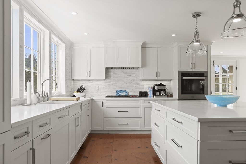 134 Main Street Nantucket, MA 02554 - Photo 4 of 42 a kitchen with cabinets appliances a sink and a counter top space