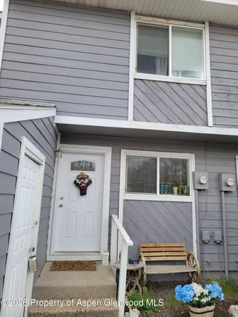 a view of house with backyard