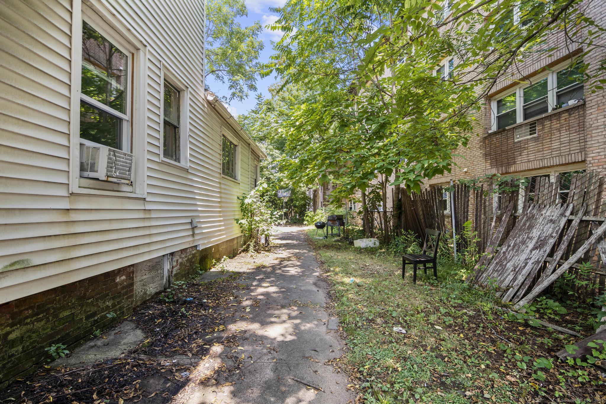 327 Center Street West Haven, CT 06516 - Photo 13 of 19 a backyard of a house with lots of green space