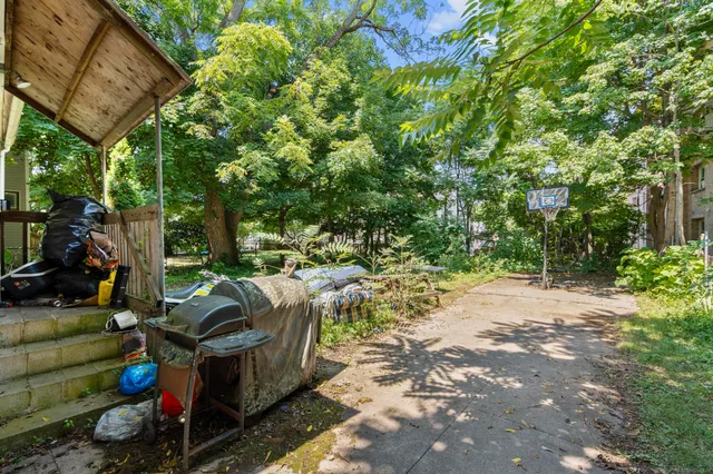 a view of yard with patio
