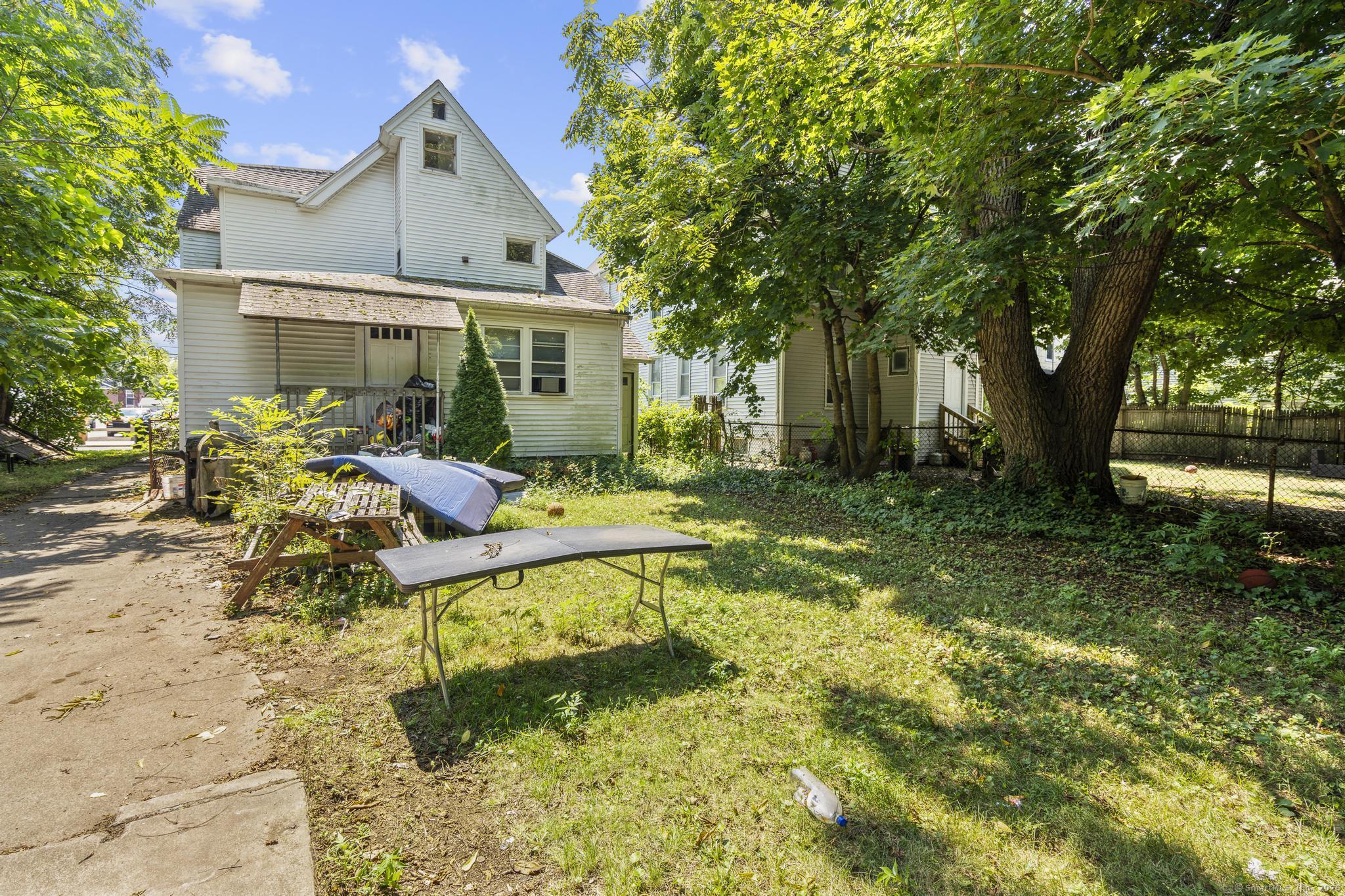 327 Center Street West Haven, CT 06516 - Photo 16 of 19 a view of backyard of house with green space