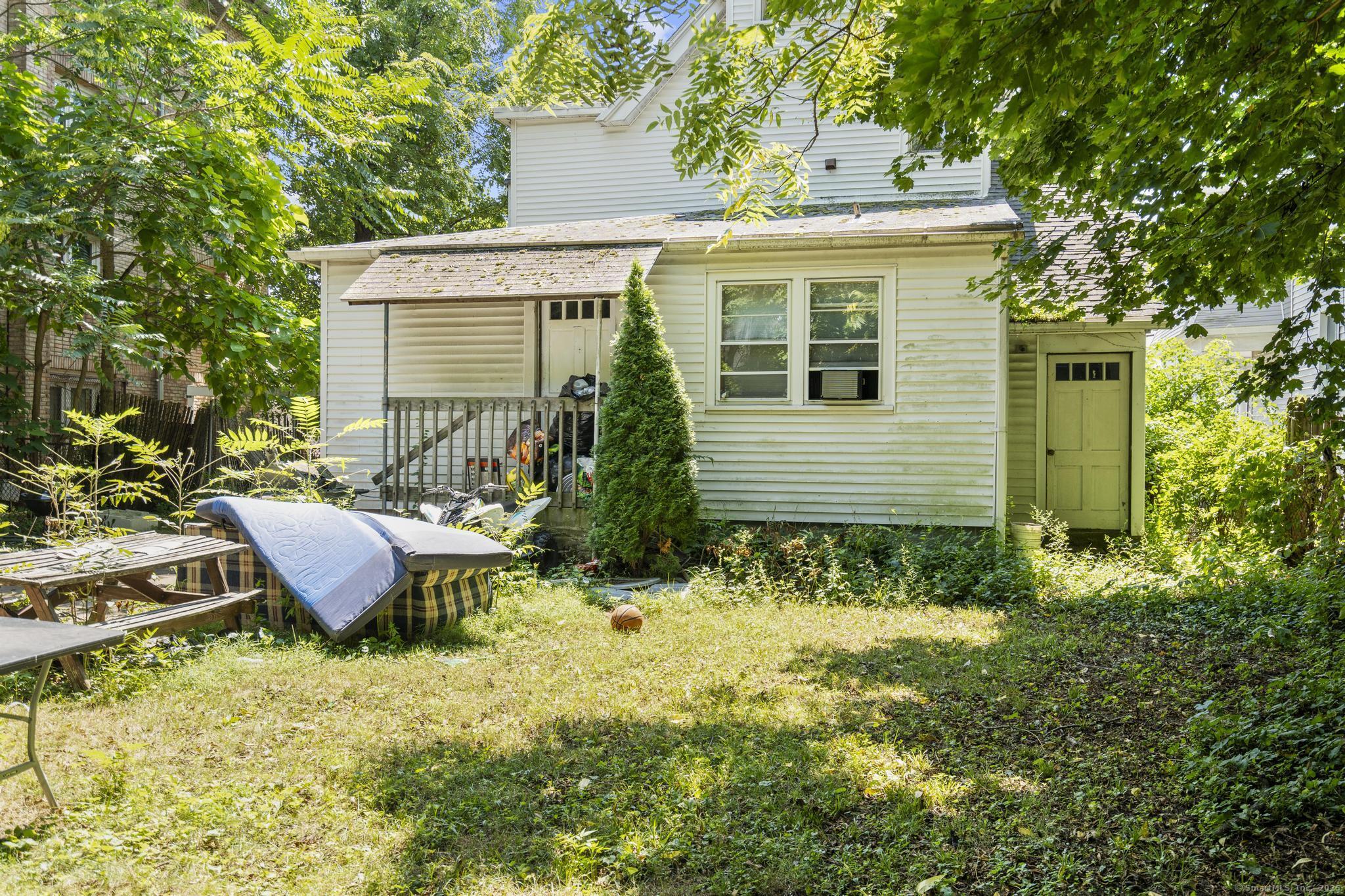 327 Center Street West Haven, CT 06516 - Photo 18 of 19 a view of a house with backyard and sitting area