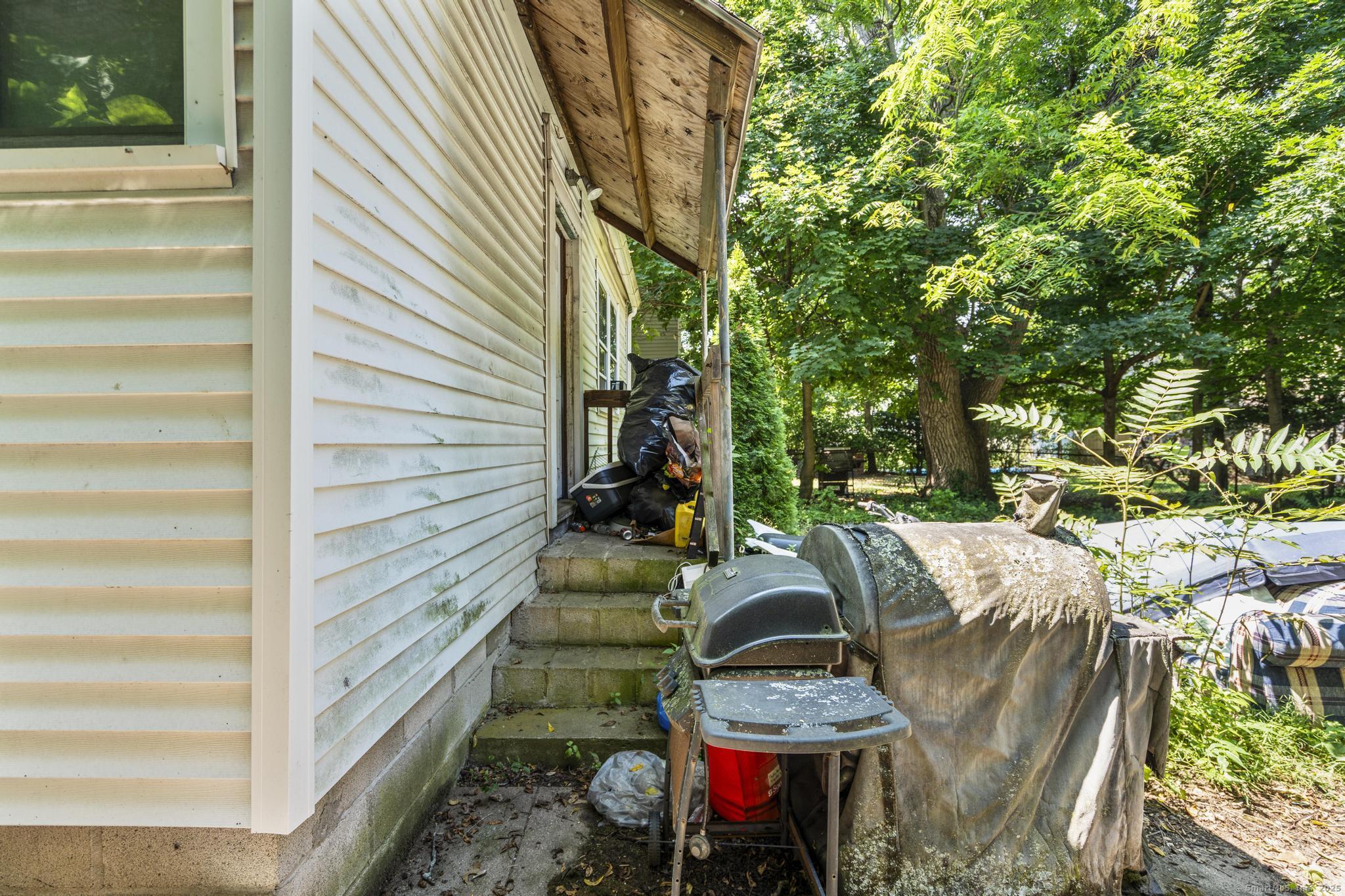 327 Center Street West Haven, CT 06516 - Photo 19 of 19 a view of backyard with outdoor seating and trees