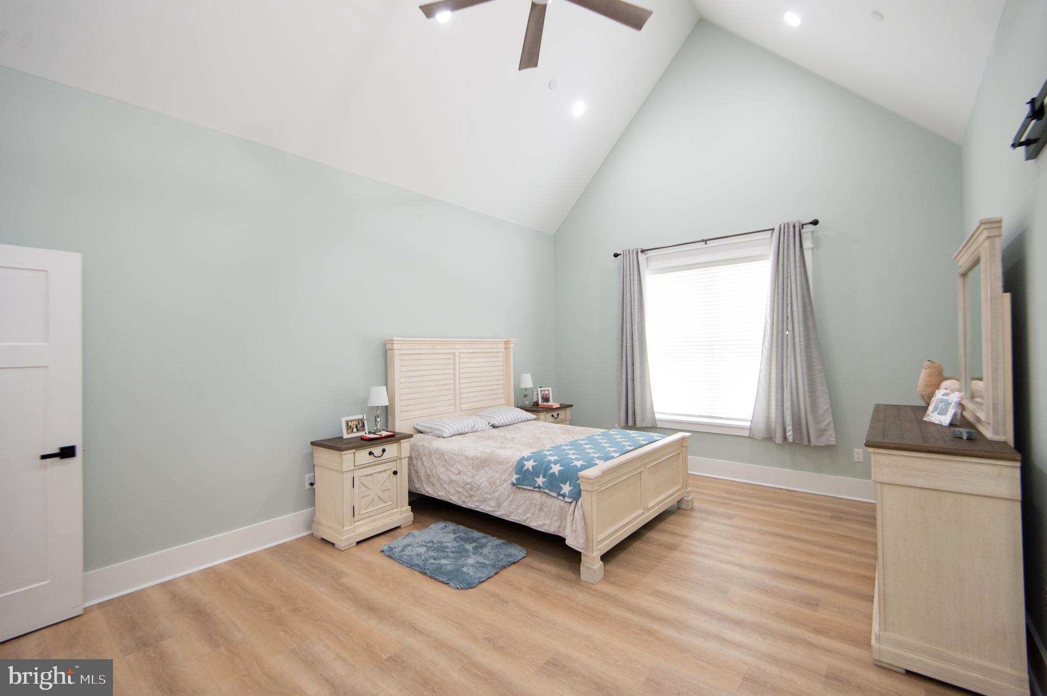 9509 Rum Ridge Road Delmar, MD 21875 - Photo 20 of 76 a bedroom with a bed and a dresser