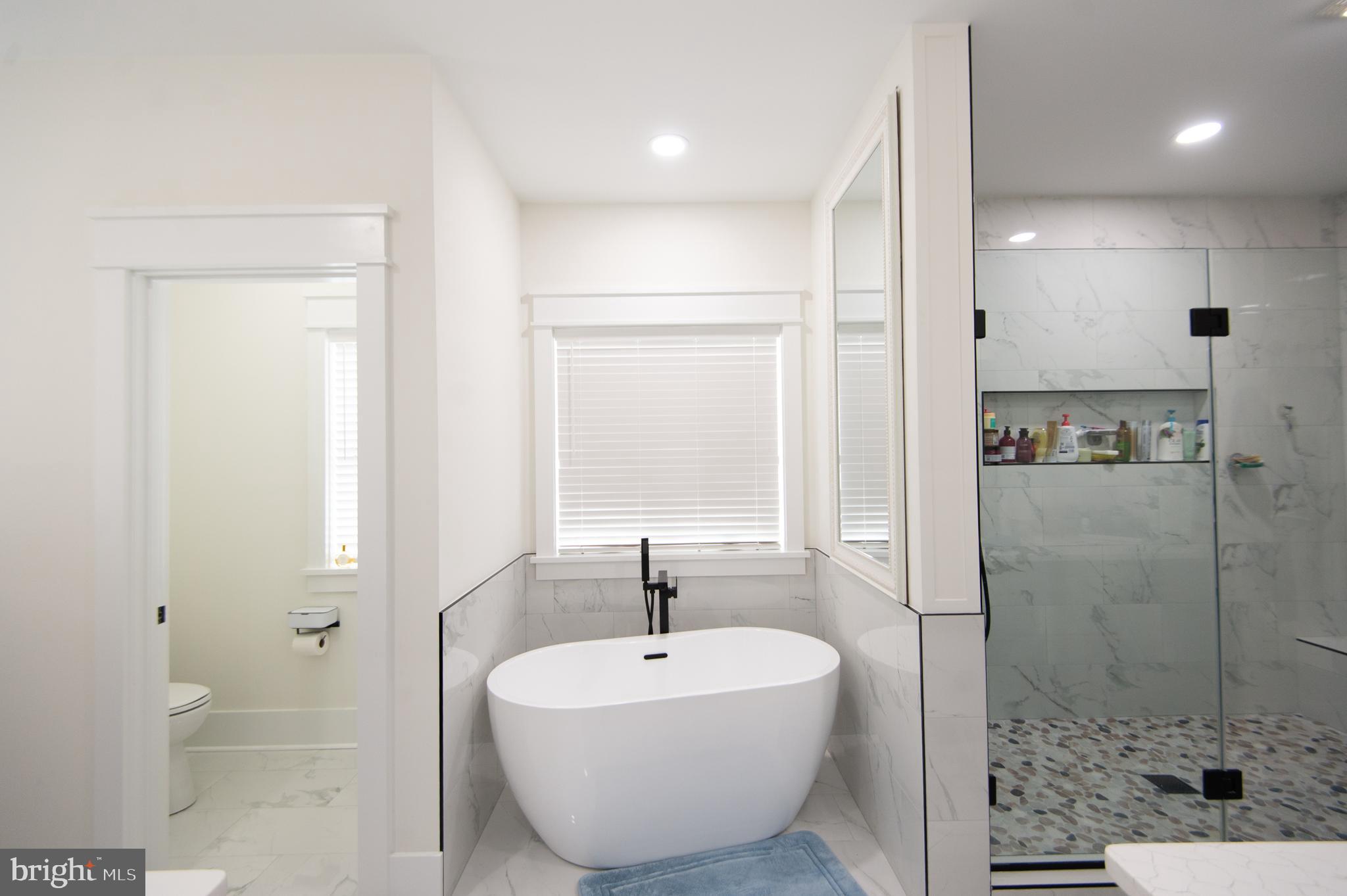 9509 Rum Ridge Road Delmar, MD 21875 - Photo 23 of 76 a bathroom with a sink and a mirror
