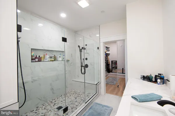 a bathroom with a sink double vanity and a mirror