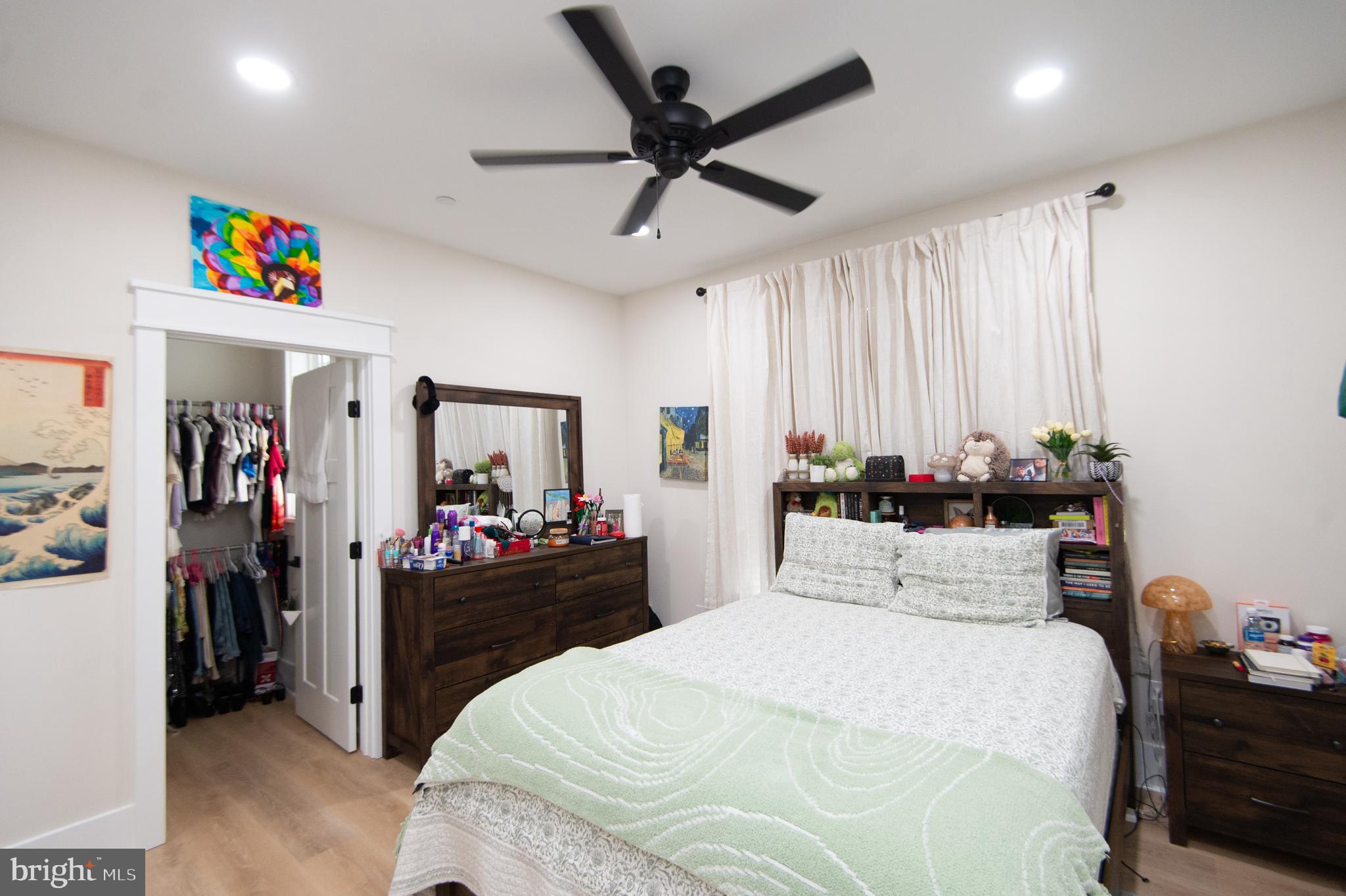9509 Rum Ridge Road Delmar, MD 21875 - Photo 29 of 76 a bedroom with a bed and a chandelier