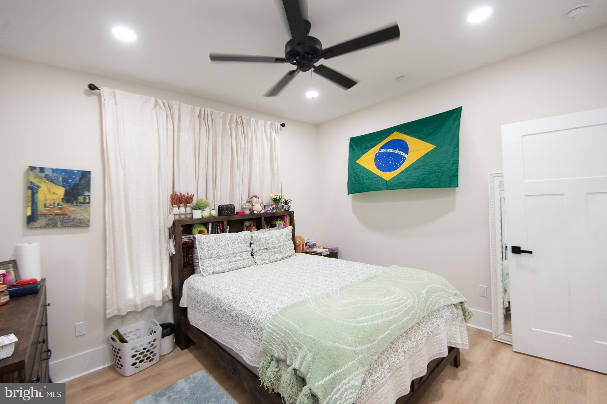 9509 Rum Ridge Road Delmar, MD 21875 - Photo 30 of 76 a bedroom with a bed and a painting on the wall