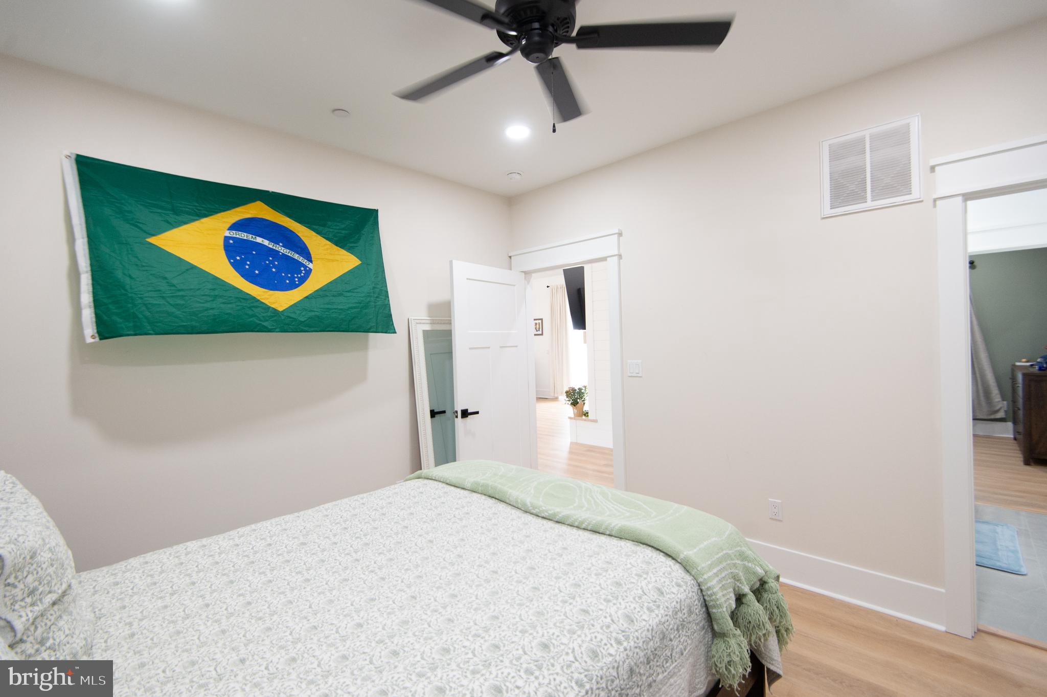 9509 Rum Ridge Road Delmar, MD 21875 - Photo 31 of 76 a bedroom with a bed and a wall painting