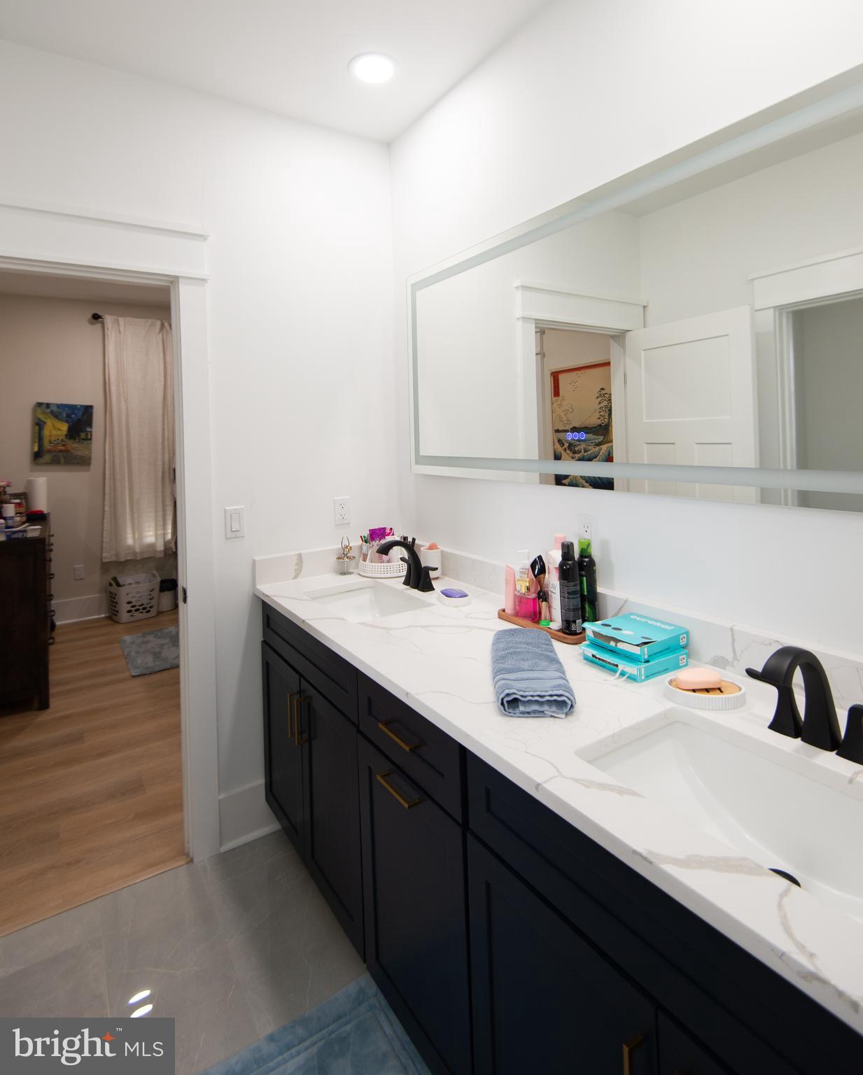 9509 Rum Ridge Road Delmar, MD 21875 - Photo 34 of 76 a bathroom with a sink double vanity and a mirror