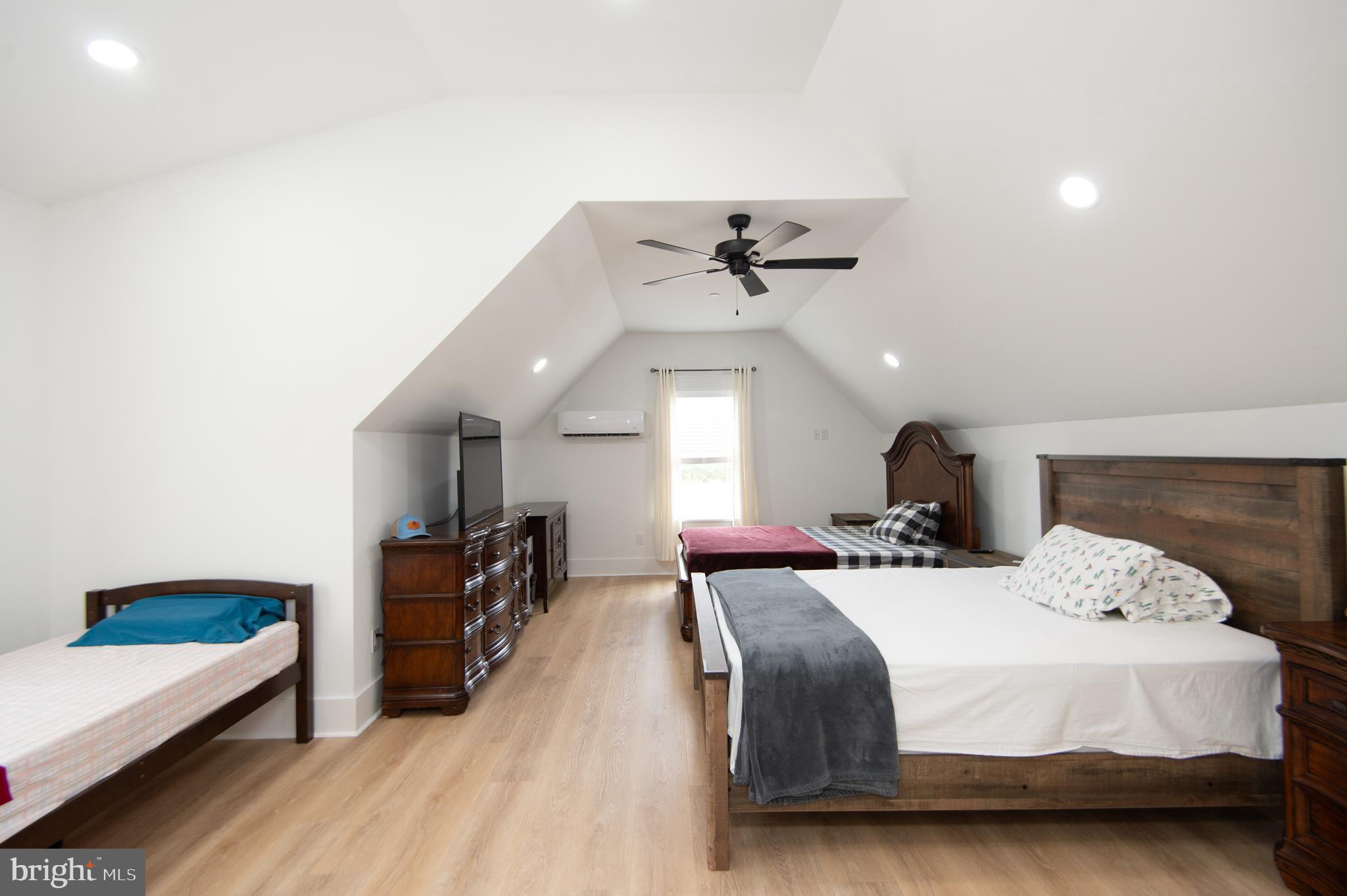 9509 Rum Ridge Road Delmar, MD 21875 - Photo 43 of 76 a bedroom with a bed and a chandelier