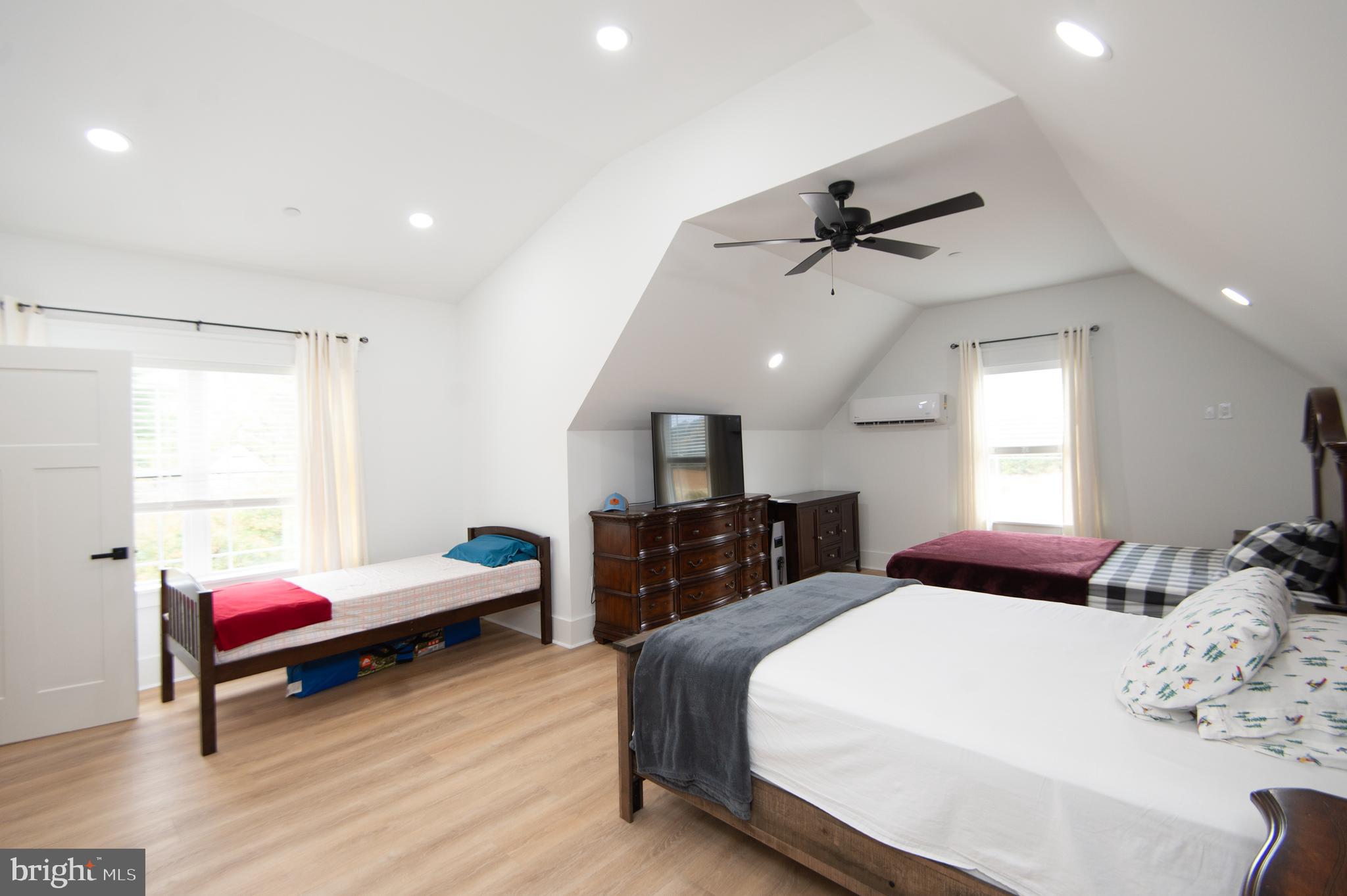 9509 Rum Ridge Road Delmar, MD 21875 - Photo 44 of 76 a bedroom with a bed and wooden floor