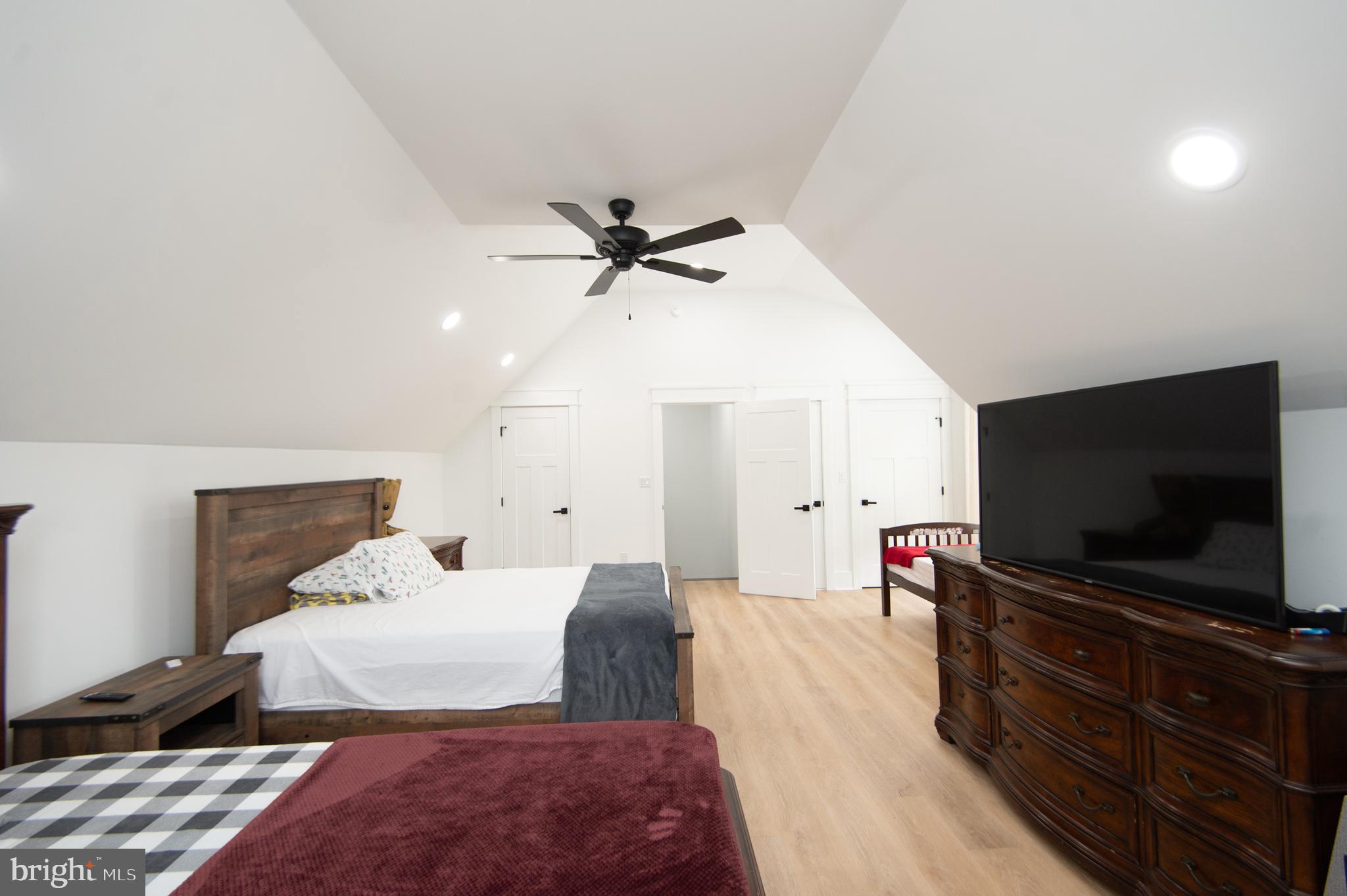 9509 Rum Ridge Road Delmar, MD 21875 - Photo 46 of 76 a bedroom with a bed and a flat screen tv