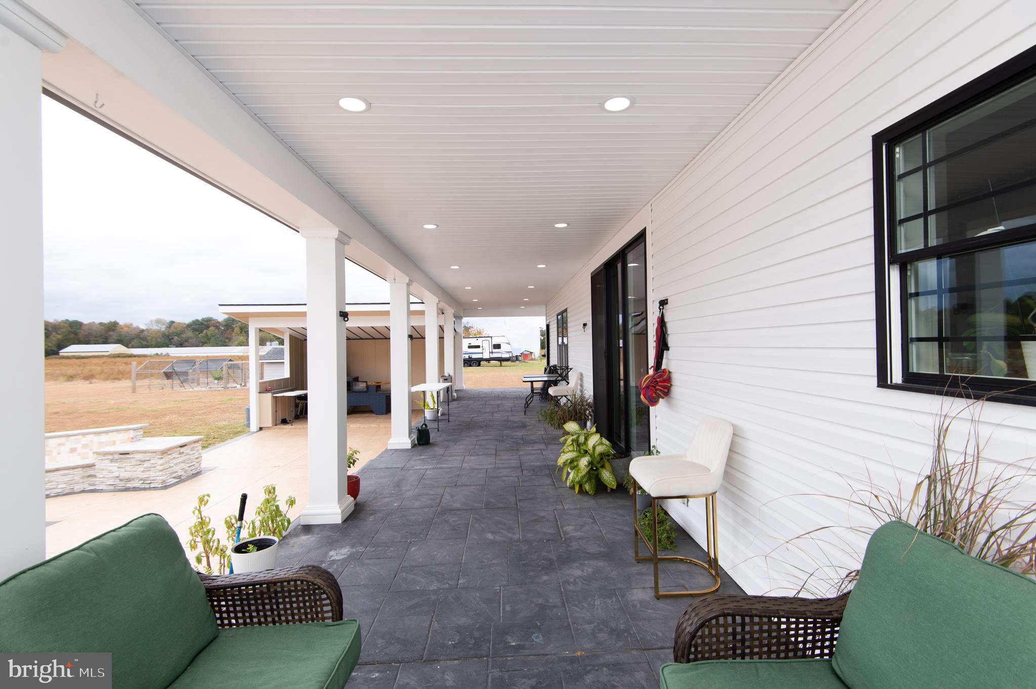 9509 Rum Ridge Road Delmar, MD 21875 - Photo 52 of 76 a living room with furniture and a large window
