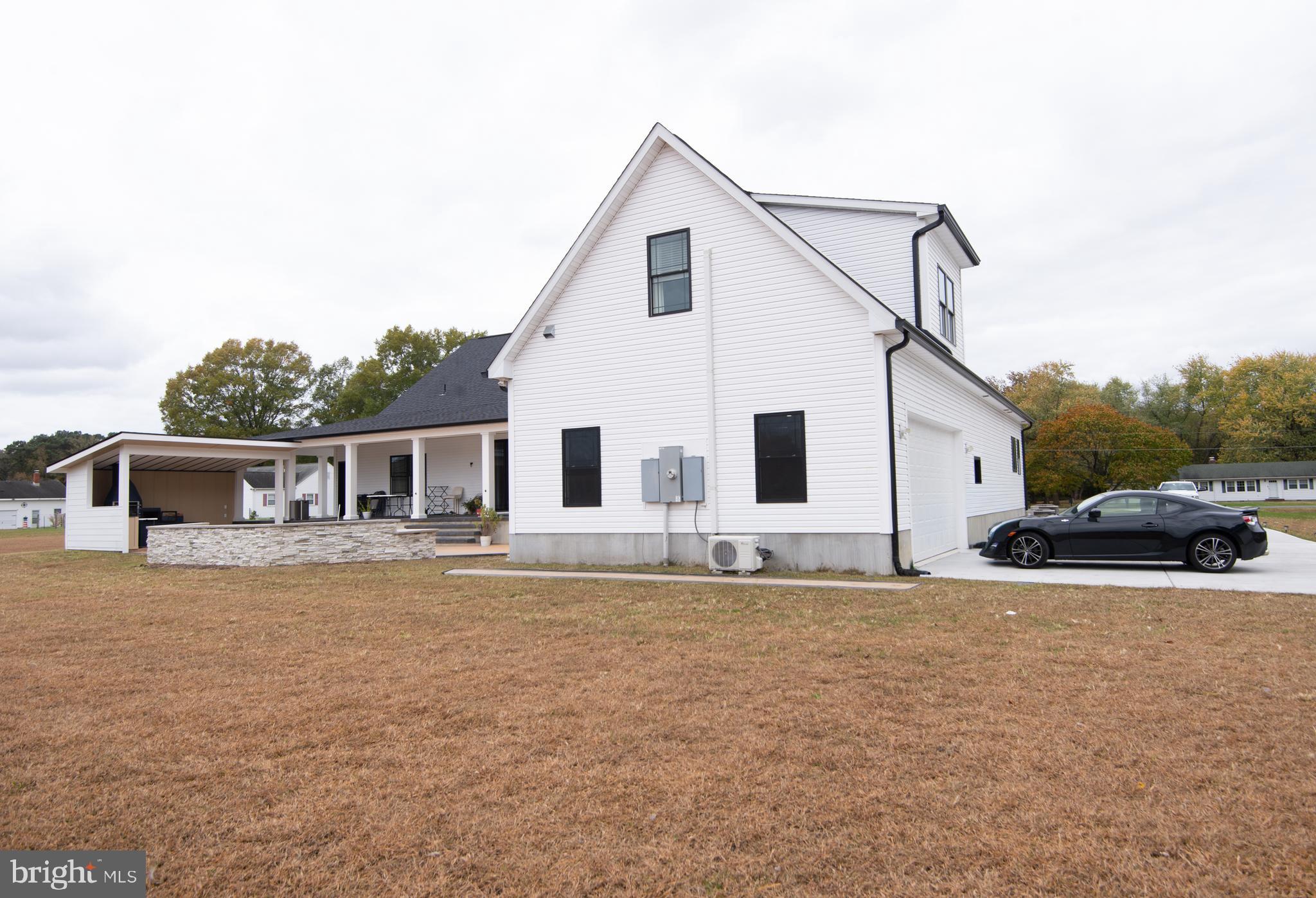 9509 Rum Ridge Road Delmar, MD 21875 - Photo 64 of 76 a white house that has a tree in front of it