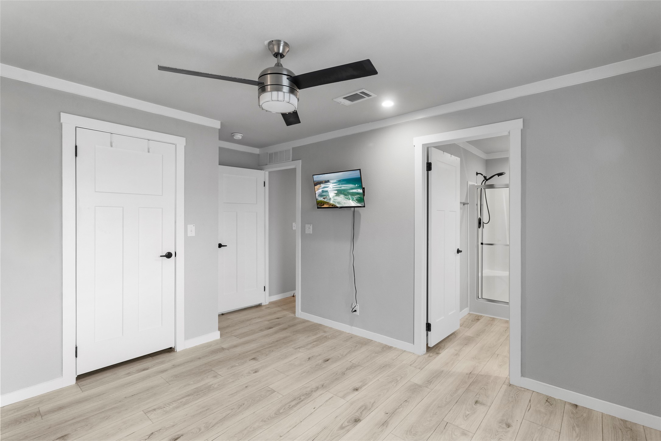 119 Mooney Road Pearland, TX 77581 - Photo 11 of 25 an empty room with wooden floor and windows