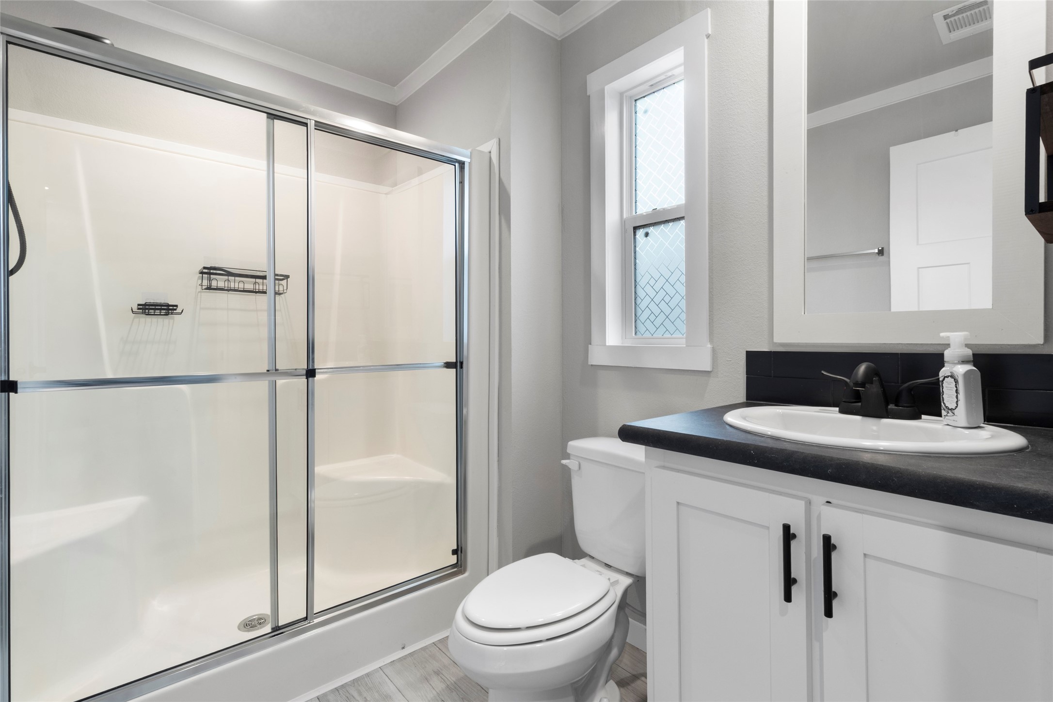 119 Mooney Road Pearland, TX 77581 - Photo 12 of 25 a bathroom with a granite countertop sink toilet and shower