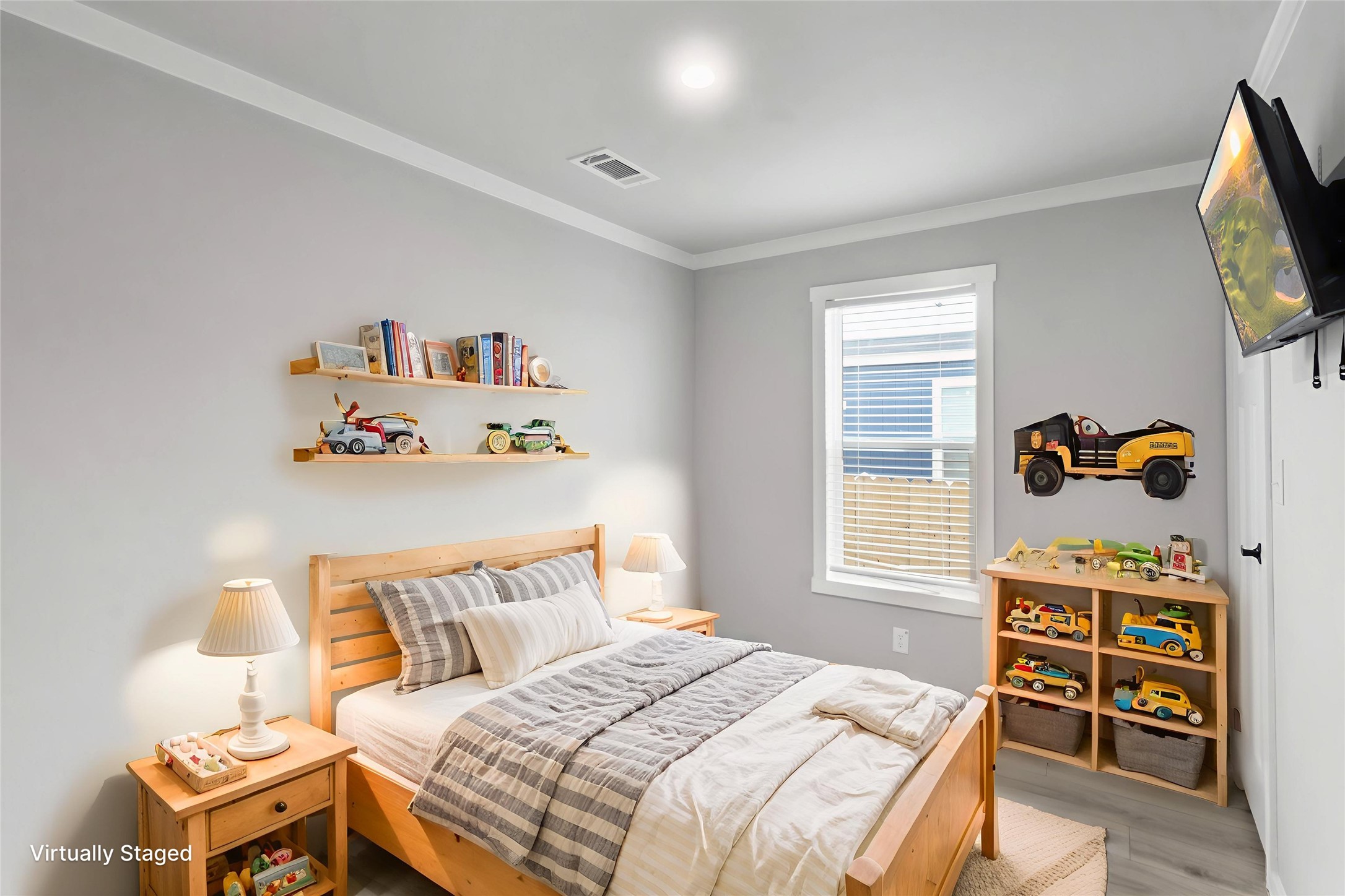 119 Mooney Road Pearland, TX 77581 - Photo 14 of 25 a bedroom with a bed and a window