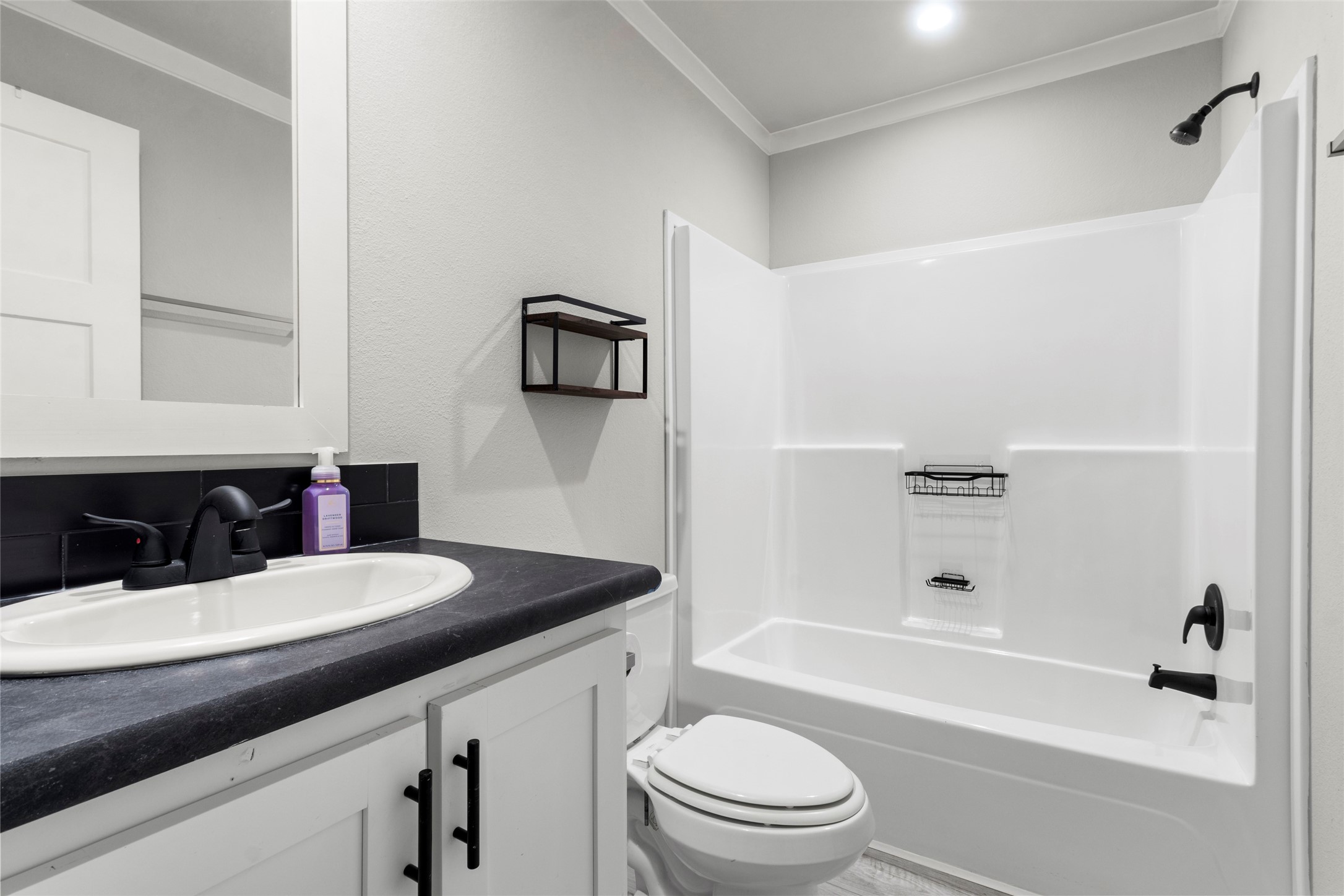 119 Mooney Road Pearland, TX 77581 - Photo 15 of 25 a bathroom with a granite countertop sink toilet and shower