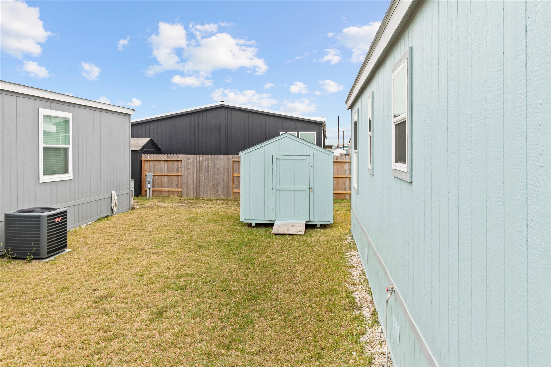 119 Mooney Road Pearland, TX 77581 - Photo 19 of 25 a bathroom with a sink a mirror and a shower